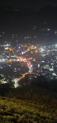 a view of a city lit up at night at Aroma Villa in Nawalapitiya