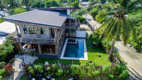 an aerial view of a house with a swimming pool at Tabularasa - T Palawan in San Vicente