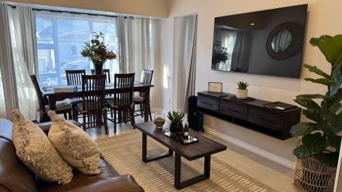 a living room with a couch and a table at The Urban Elm Guesthouse in Antwerp