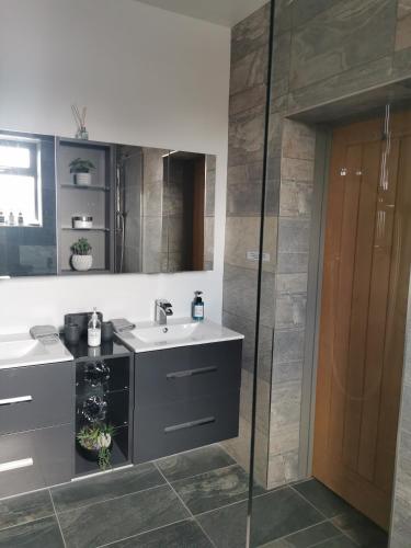 a bathroom with a sink and a mirror at No.3 in Cardiff