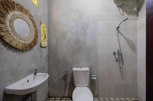 a bathroom with a shower and a toilet and a sink at The Lavana De'Bale Marcapada in Saba