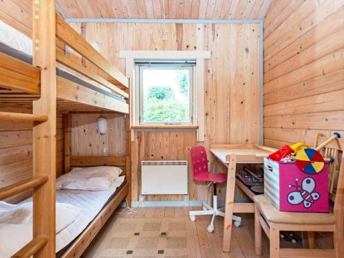 a bedroom with two bunk beds and a desk at 6 person holiday home in Silkeborg-By Traum in Silkeborg