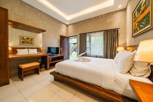 Uma Mani Villa Jimbaranにあるベッド
