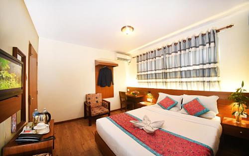 Postel nebo postele na pokoji v ubytování Hotel Amaryllis