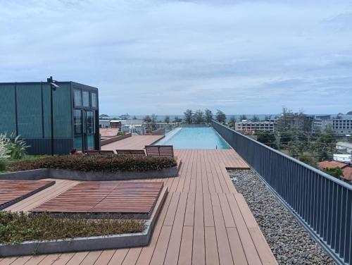 a swimming pool on the roof of a building at The Deck Patong in Patong Beach