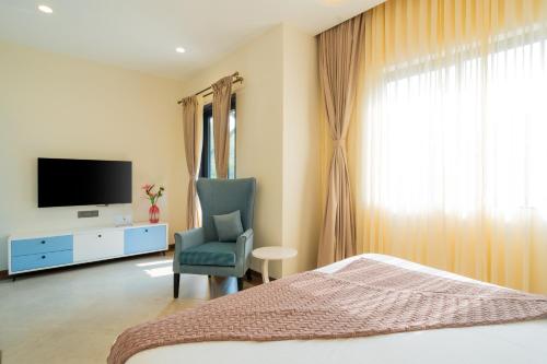 TV a/nebo společenská místnost v ubytování Hotel Regent Laguna