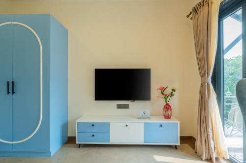 TV a/nebo společenská místnost v ubytování Hotel Regent Laguna