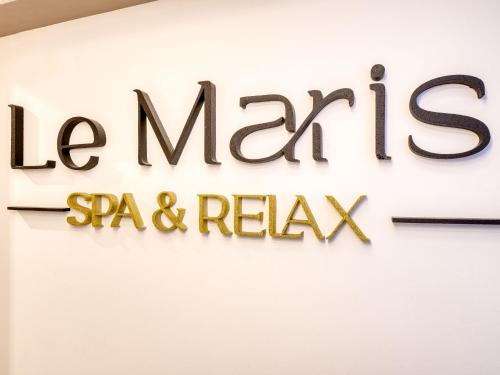 a sign for the la marias spa and relominium at Villa Le Maris by Interhome in Dobrinj