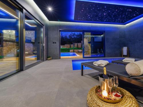 a living room with a couch and a table at Villa Le Maris by Interhome in Dobrinj