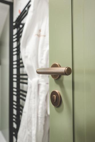 a person is standing behind a door at Boutique Hotel San Rocco in Brtonigla