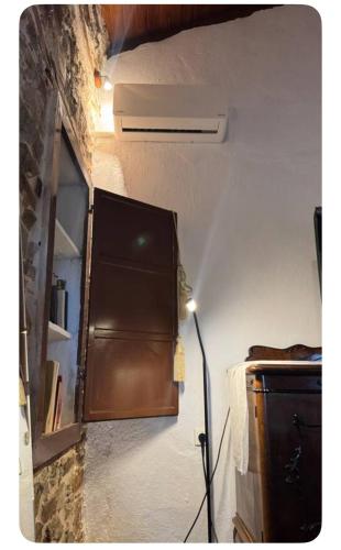 a room with a wall with a heater and a window at Villa Tzeni Palios Panteleimon in Panteleímon