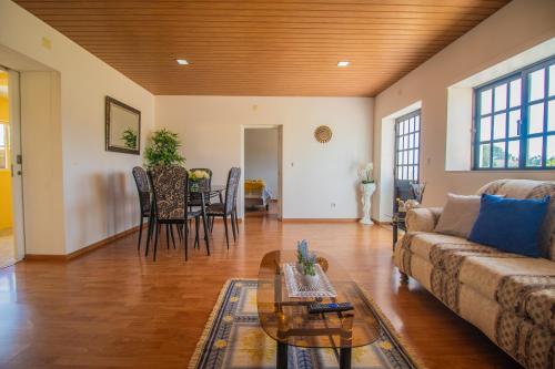 a living room with a couch and a table at Quinta Ti Lita in Tocha