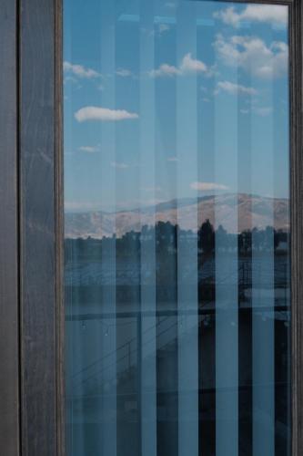 a view of the mountains from a window at Dali Healing Yard 喜洲禾隐星登 in Dali