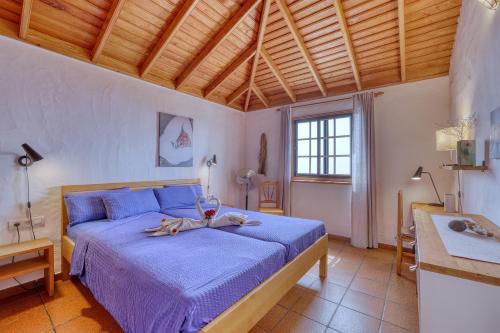 Postel nebo postele na pokoji v ubytování La Hacienda BuenVivir - Apartamentos