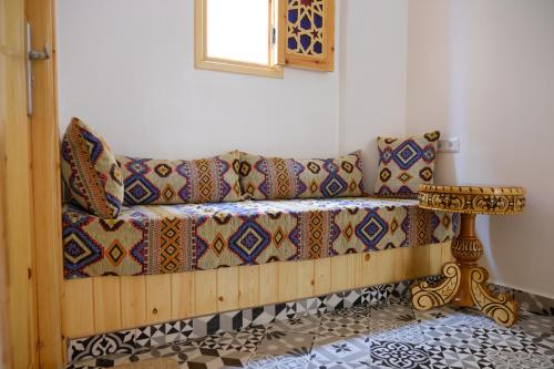 Ένα ή περισσότερα κρεβάτια σε δωμάτιο στο Aura Guest House
