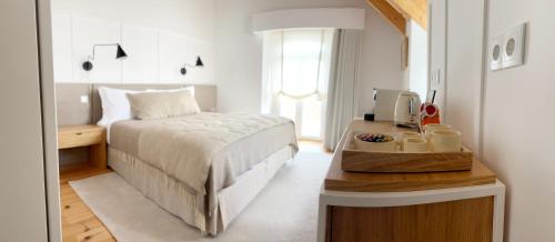 Postel nebo postele na pokoji v ubytování Live Sintra Boutique Guest House