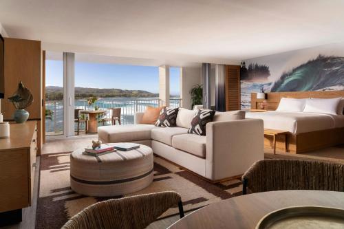 a living room with a couch and a bed at The Ritz-Carlton O'ahu, Turtle Bay in Kahuku