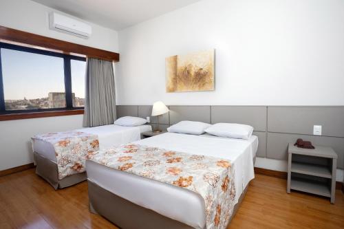 Кровать или кровати в номере Hotel Nacional Inn Belo Horizonte