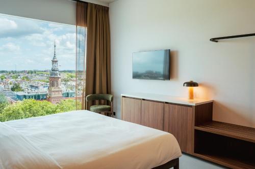 TV a/nebo společenská místnost v ubytování Hotel V Oosterpark by Conscious
