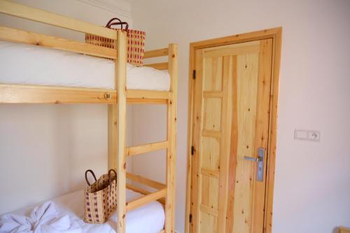 Ένα ή περισσότερα κρεβάτια σε δωμάτιο στο Aura Guest House