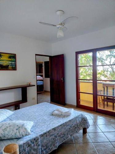 Postel nebo postele na pokoji v ubytování Suites Brilho do Sol