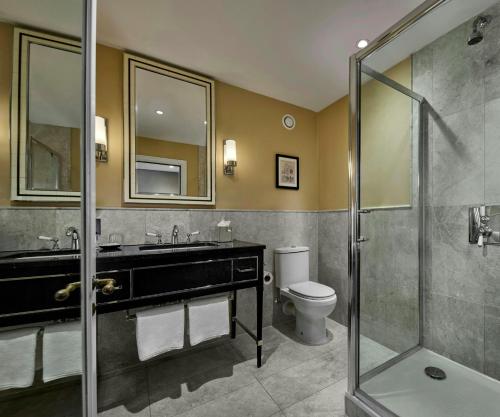a bathroom with a sink and a toilet and a shower at The Gainsborough Bath Spa - Small Luxury Hotels of the World in Bath