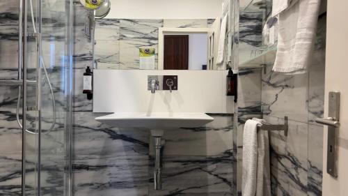 a bathroom with a sink and a shower at Quinta Colina by Shiadu in Lisbon