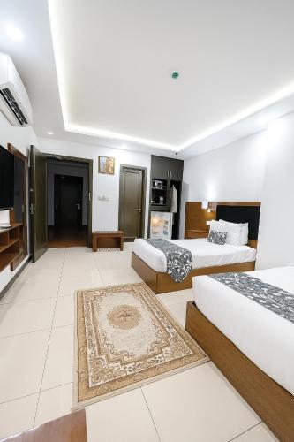 Ένα ή περισσότερα κρεβάτια σε δωμάτιο στο Grand Mongolia Hotel