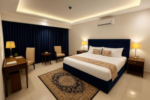 Ένα ή περισσότερα κρεβάτια σε δωμάτιο στο Grand Mongolia Hotel