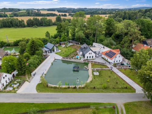 an aerial view of a house with a large pond at Holiday Home Ayurvedic Palace by Interhome 