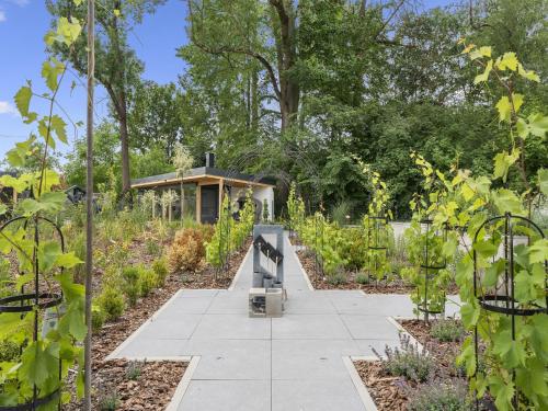 a garden with a greenhouse in the background at Holiday Home Ayurvedic Palace by Interhome 