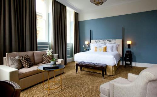 a hotel room with a bed and a couch at The Gainsborough Bath Spa - Small Luxury Hotels of the World in Bath