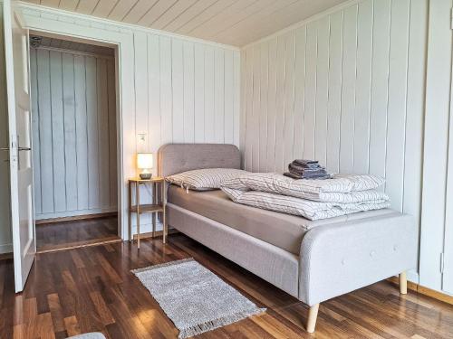 a bedroom with a bed in a room at Chalet Haus am See by Interhome in Niederried