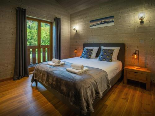 Ένα ή περισσότερα κρεβάτια σε δωμάτιο στο Chalet Chamaline - OVO Network