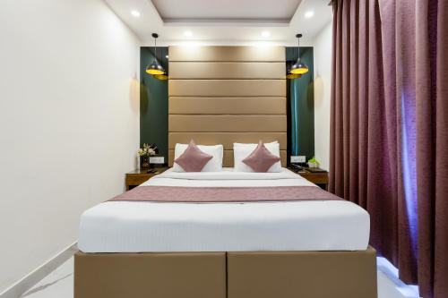 PK Boutique Hotel Noida Expresswayにあるベッド