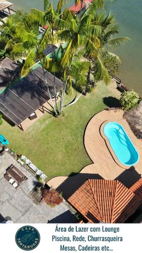 a flyer for a resort with a swimming pool at Casa das Tartarugas in Angra dos Reis