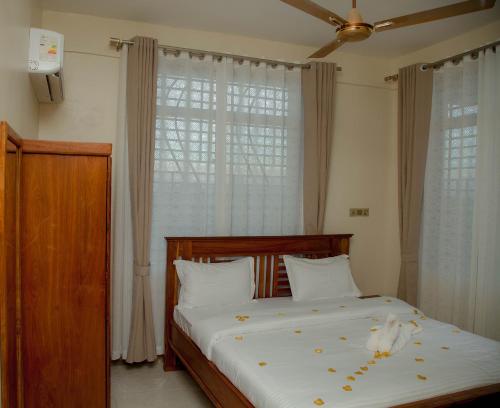 Ένα ή περισσότερα κρεβάτια σε δωμάτιο στο Ais apartments
