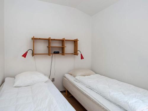 two beds in a room with white walls at 5 person holiday home in Odder-By Traum in Odder