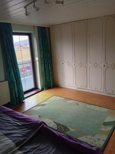 a room with a rug on the floor and a window at Ferienwohnung Baumann Alois in Furth im Wald