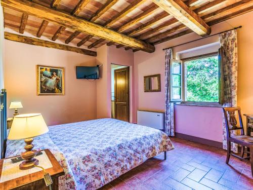 Katil atau katil-katil dalam bilik di Holiday Home Podere San Giuseppe-1 by Interhome