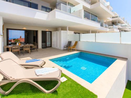 an image of a house with a swimming pool at Apartment Bayview Collection free Spa & Padel by Interhome in Torrox Costa