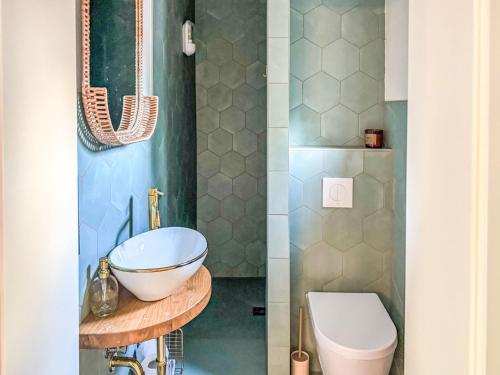 a bathroom with a sink and a toilet at Apartment Hinterhov Koje by Interhome in Beeskow