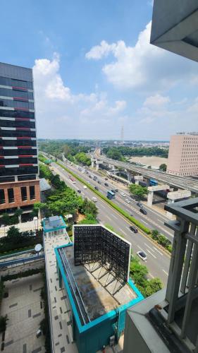 an aerial view of a city with a highway at Apartemen H Residence in Jakarta