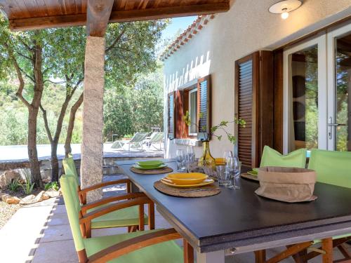 a dining room with a table and chairs at Holiday Home Chidda Di by Interhome in Trudda