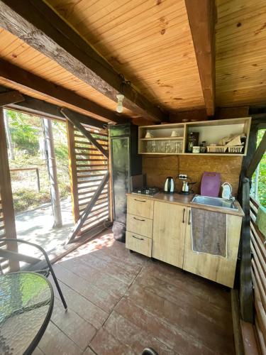 a kitchen with a sink and a counter top at Chateau Maxuntseti in K'veda Bzubzu