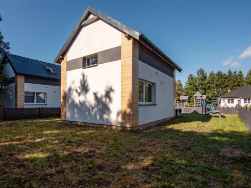 a small house with a large yard at Holiday Home Gęsia Kępa by Interhome 