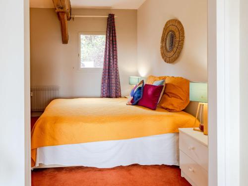 a bedroom with a bed and a window at Apartment La Pinchonnière-8 by Interhome in Tourgeville