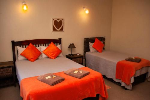 Ένα ή περισσότερα κρεβάτια σε δωμάτιο στο Cairos Guest House