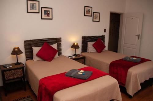 Ένα ή περισσότερα κρεβάτια σε δωμάτιο στο Cairos Guest House
