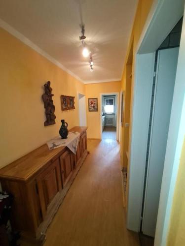 a hallway of a home with a room with a table at Appartement THERESE by MoniCare in Seefeld in Tirol